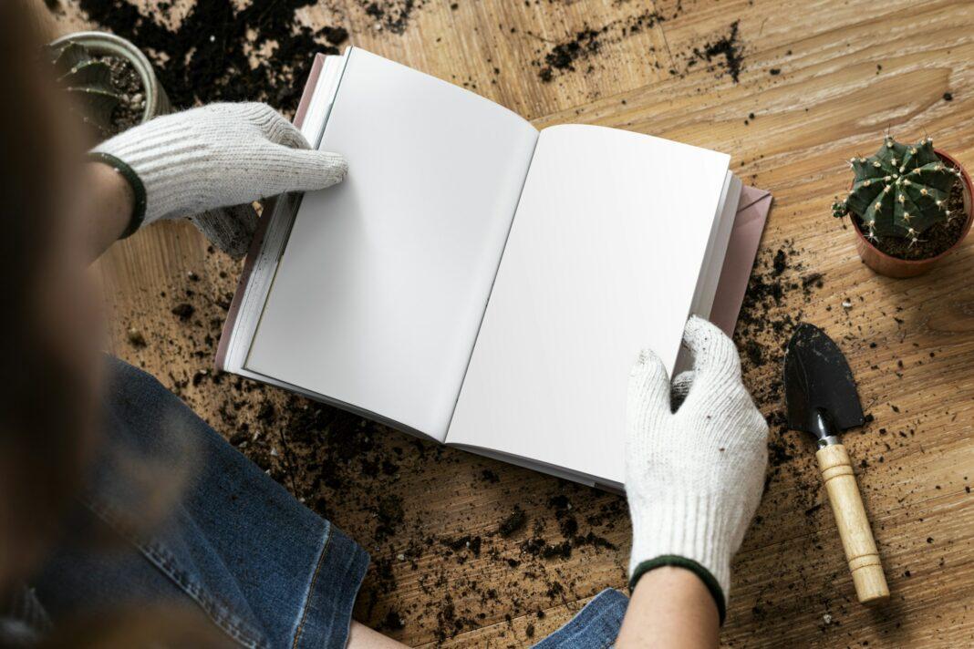 Empty book in the hands of a gardener